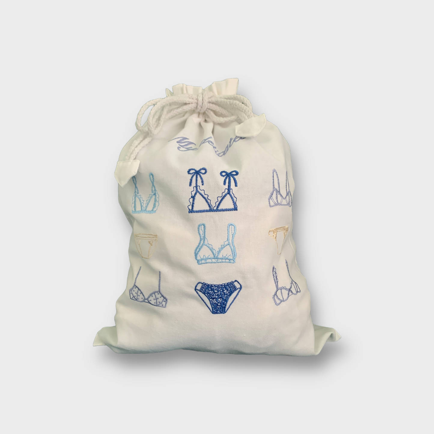 Delikat undertøypose i lin og bomull med broderi