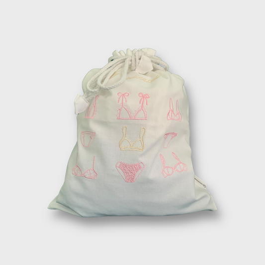 Pakkepose med rosa broderier